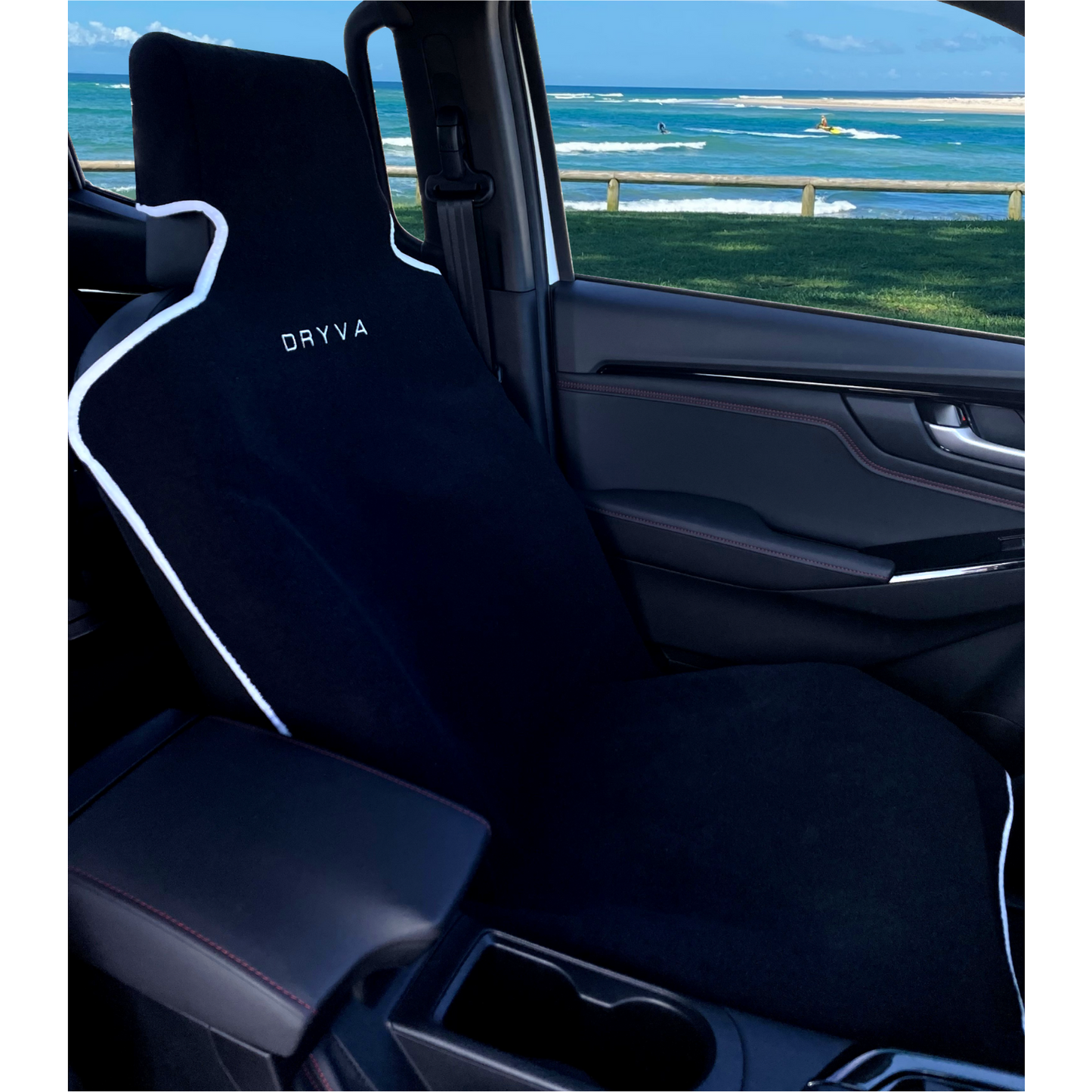 Black car seat cover in black leather at the beach